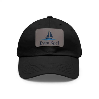 Black baseball cap featuring a sailboat patch from Even Keel Branded Dad Hat collection