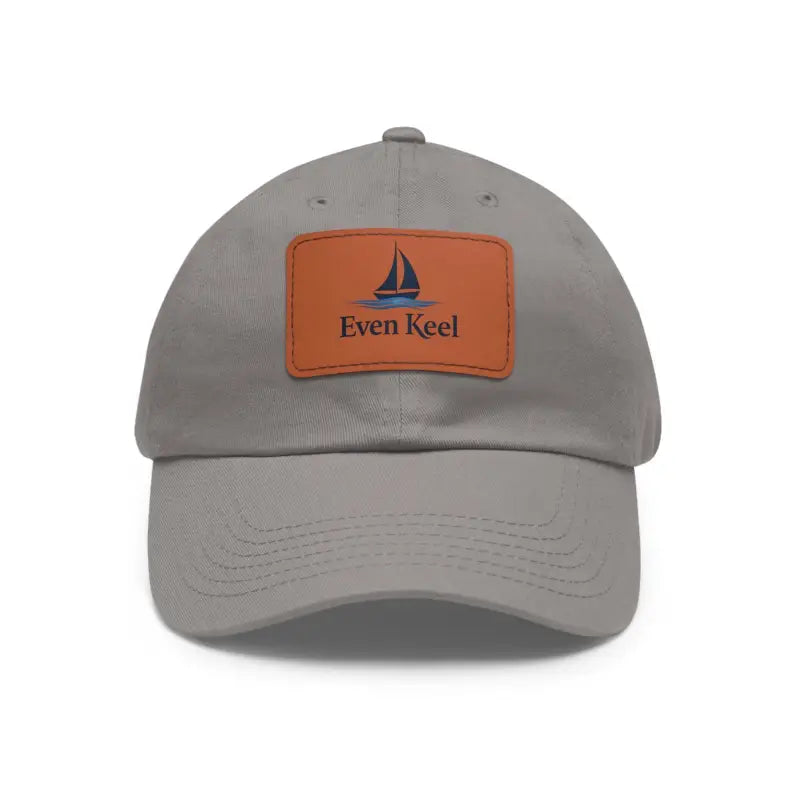 Gray baseball cap featuring a sailboat patch as part of Even Keel Signature Dad Hat