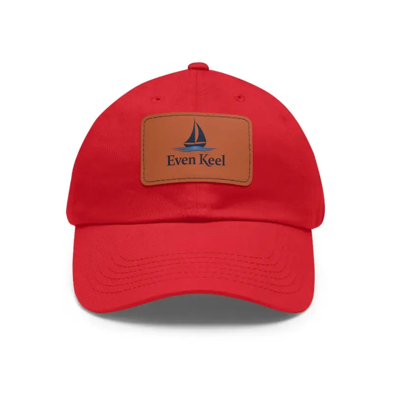 Red baseball cap featuring a sailboat patch from the Even Keel Signature Dad Hat collection