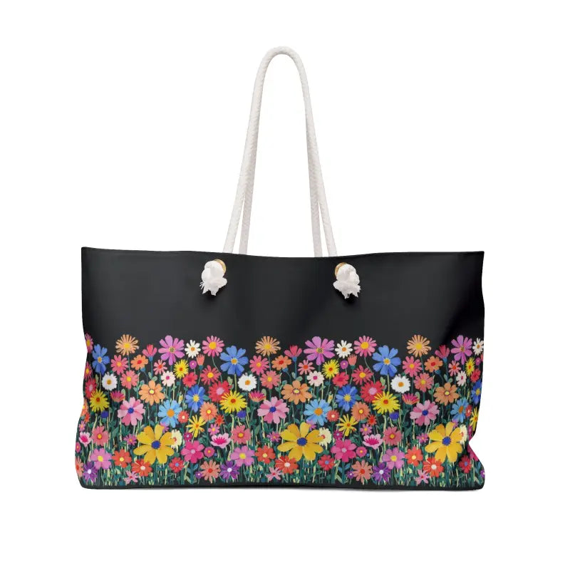 Black tote bag featuring a vibrant floral pattern, ideal for travel and stylish outings