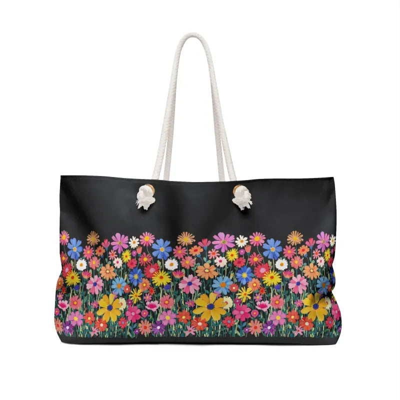 Black tote bag featuring a colorful floral print from the Floral Weekender Bag collection