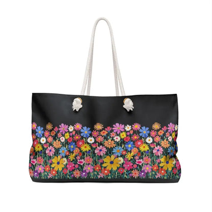 Black tote bag featuring a colorful floral print from the Floral Weekender Bag collection