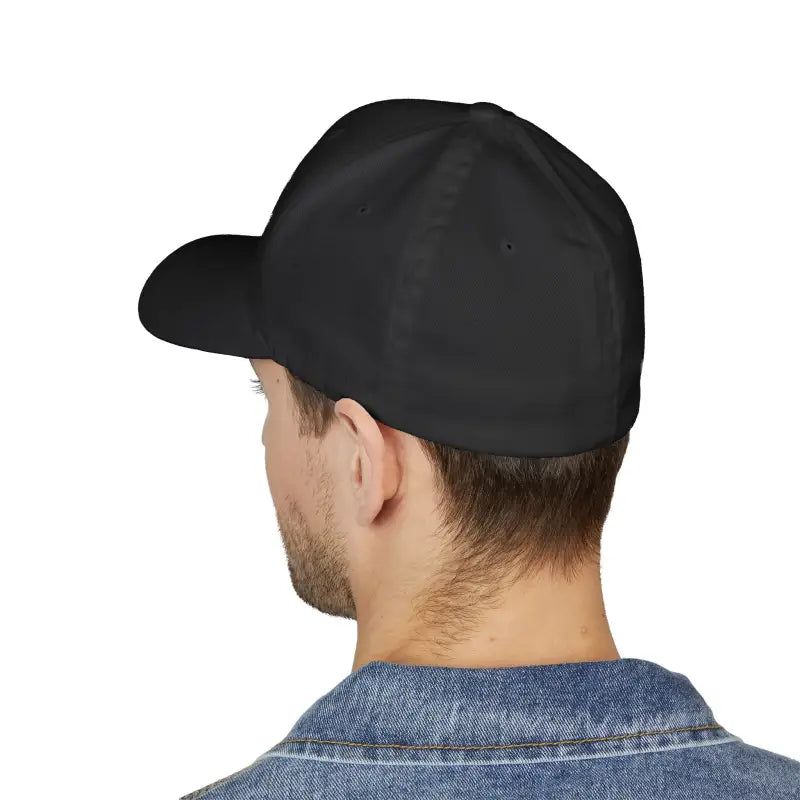 Black baseball cap worn by a man, featuring Newport Rhode Island embroidery