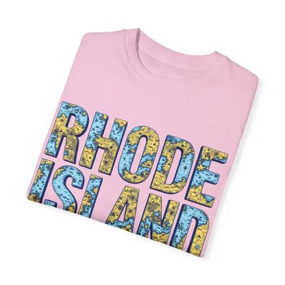 Folded pink Rhode Island t-shirt showcasing casual coastal vibe garment dye style