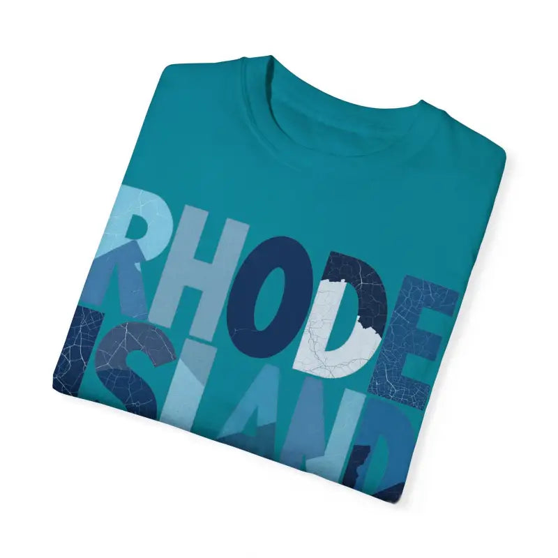 Folded teal Rhode Island Unisex Garment Dyed Summer T Shirt displayed attractively