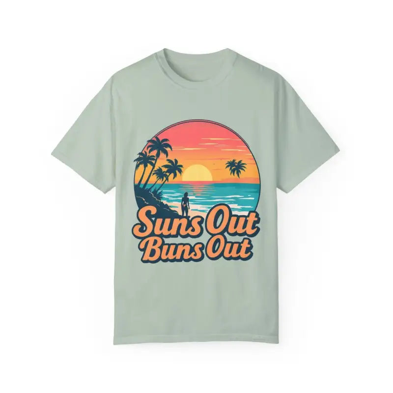 Light green Suns Out Buns Out t-shirt featuring a beach sunset graphic design