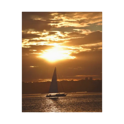 Sailboat silhouetted against a vibrant sunset in Sunset Sailboat Silhouette