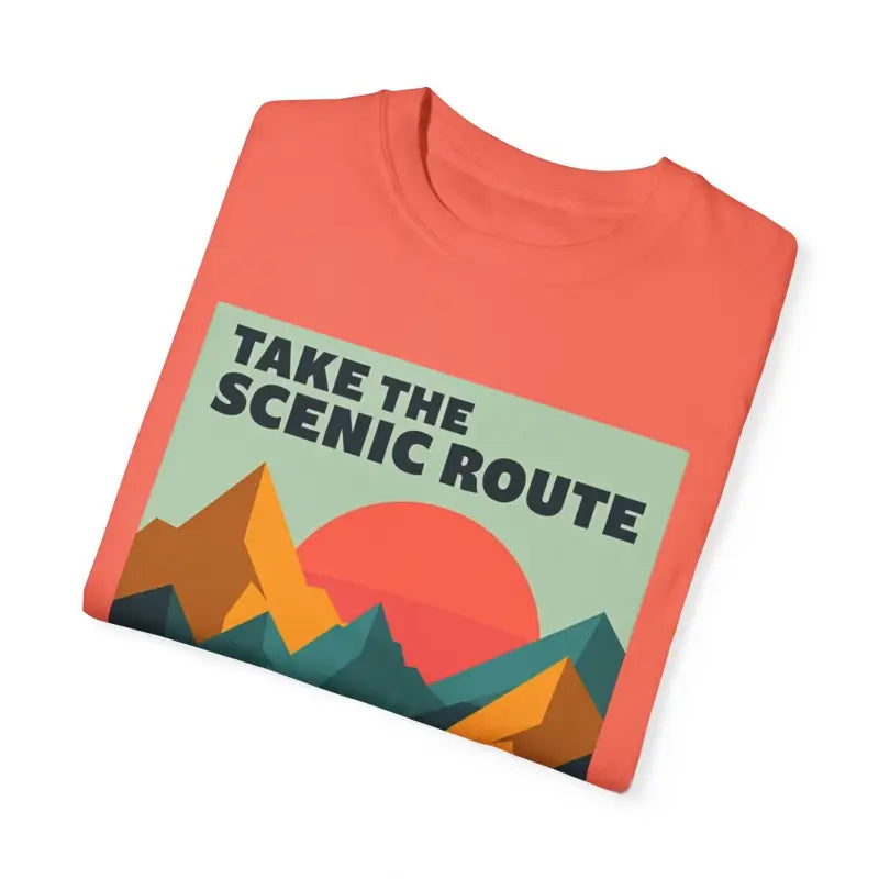 Folded coral unisex T-shirt with mountain graphic from Take the Scenic Route collection