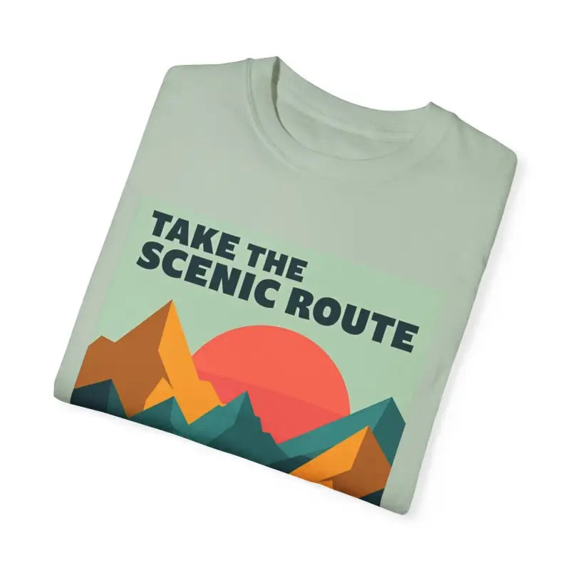 Folded unisex T-shirt featuring mountain graphic from Take the Scenic Route Adventure collection